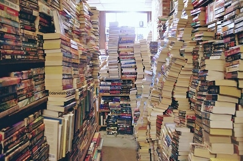 Hoarding books as high as walls min - How Clutter Affects You and (Maybe) Your Home’s Feng Shui