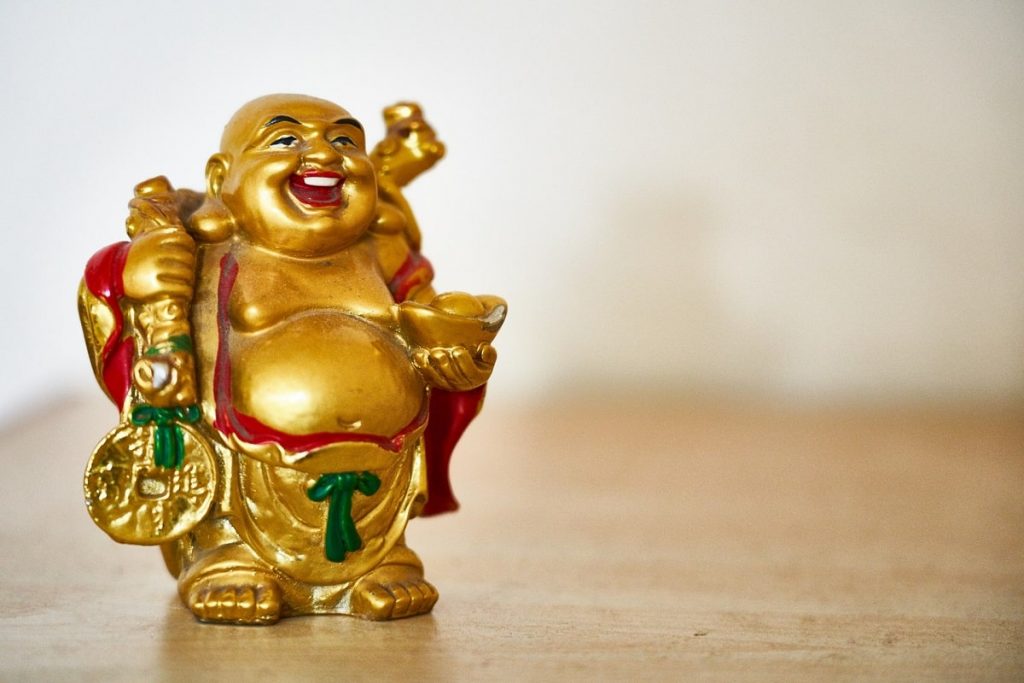 Laughing buddha figurine feng shui min 1024x683 - 7 Best Ways to Boost Feng Shui Energy