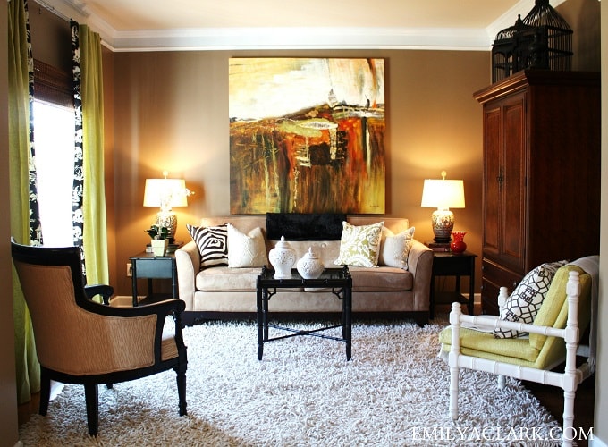 living room sofa artwork hung on wall behind fen gshui min - 27 Feng Shui Living Room Tips & Rules: Location, Design, Furniture, and Items