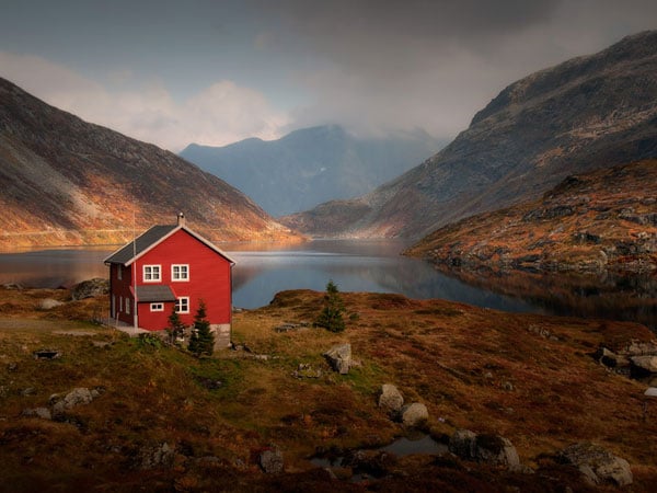 red house by lake and mountain - Feng Shui Colors: The Science and Psychology Behind It