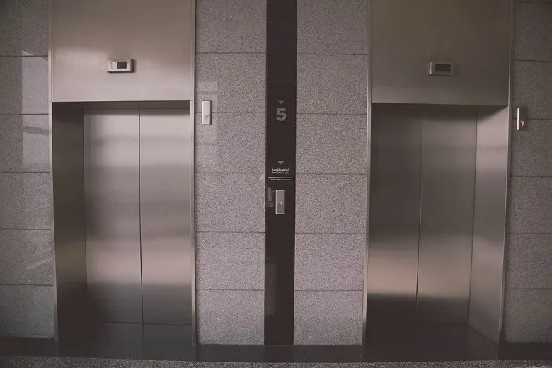 2 elevators facing