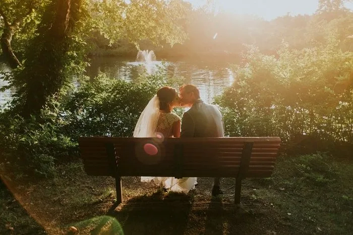 married couple on bench dusk