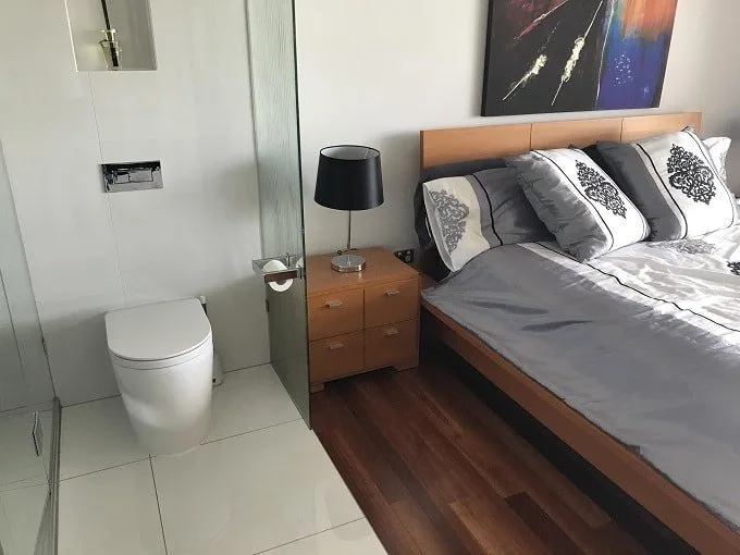 toilet sharing wall with bed feng shui